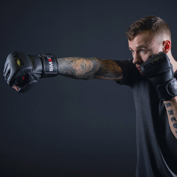 Man punching with Elite85 MMA Gloves