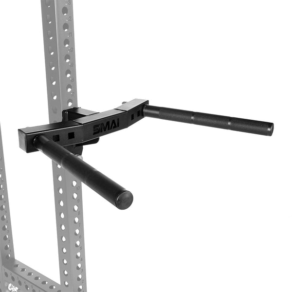 The SMAI USA Dip Station Attachment - Vanta Series features black adjustable dip arms that mount to a grey power rack with multiple holes. Parallel bars extend outward for versatile bodyweight exercises, with the "SMAI" logo on the bracket.