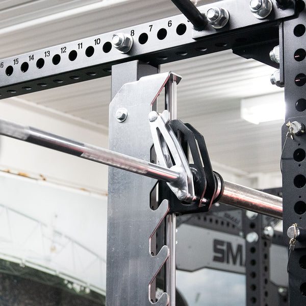 Detail of a universal smith machine for power racks showing the catcher hook
