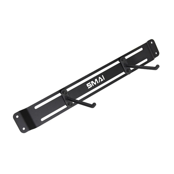 The SMAI USA Workout Mat Wall Storage Rack is a black metal wall-mounted rack with two angled hooks, a laser-cut design, and the "SMAI" logo in white at the center.