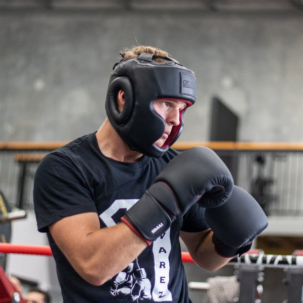 Man wearing Elite85 Boxing Headgear