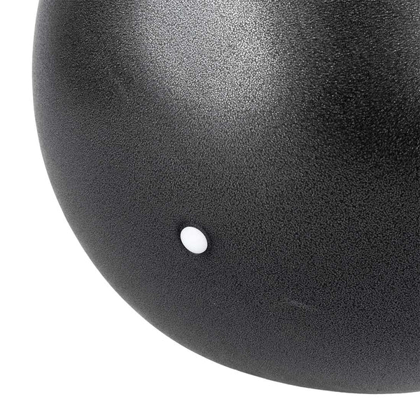 Close-up of the SMAI USA Pilates Ball - 11inch, featuring a textured matte black finish and a small white dot, perfect for core strengthening and balance exercises.