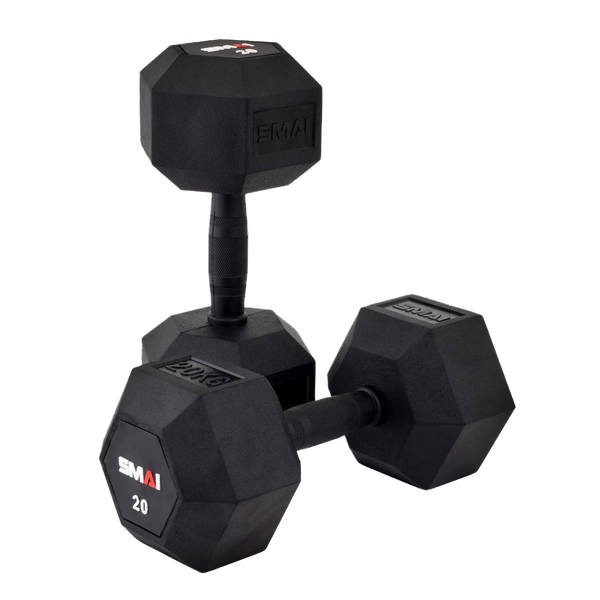 Two black hexagonal dumbbells with textured handles are stacked on a white background. The front dumbbell has "SMAI 20" written on one end.