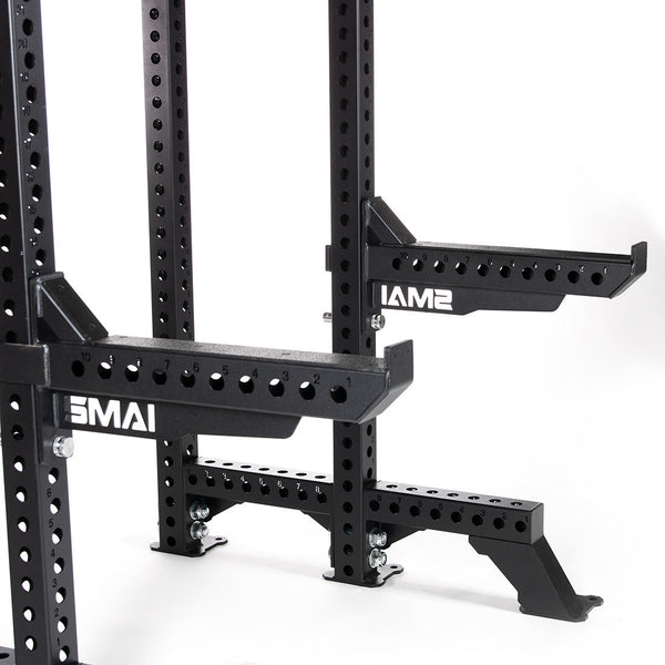 The SMAI USA Safety Spotter Arms (Pair) - Vanta Series are black metal arms with adjustability and multiple holes, compatible with Vanta Rack accessories; the white "SMAX" logo appears on the side.