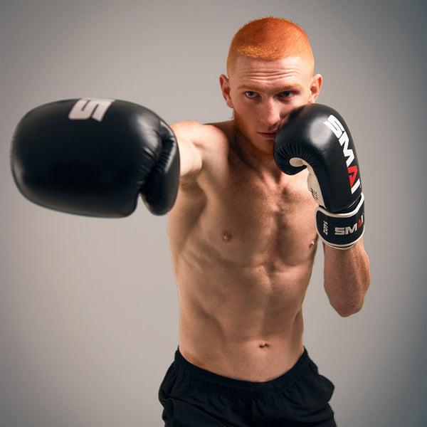 punching the SMAI Essentials Boxing Glove
