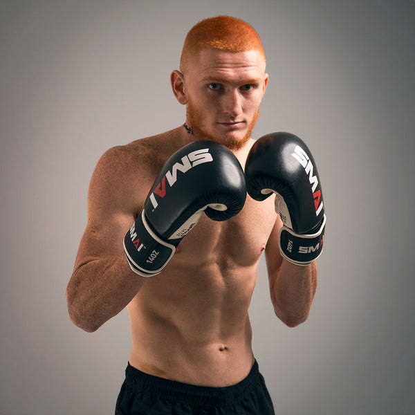 Man  wearing the SMAI Essentials Boxing Glove