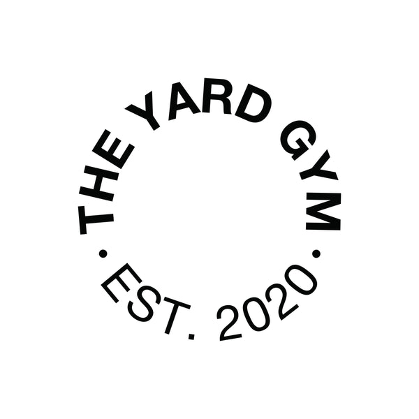 Black text that reads "THE YARD GYM" curved in a circle, with "EST. 2020" below, also curved. Both phrases are separated by two black dots, all on a white background.