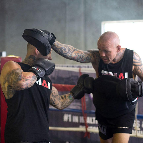 man using Elite85 Muay Thai Belly Pad