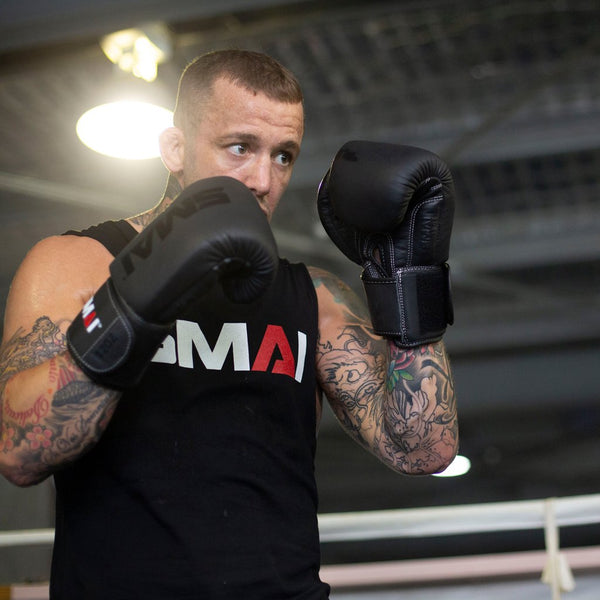 Man boxing with Elite85 Boxing Gloves