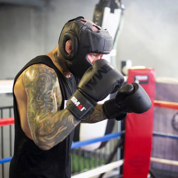 Man boxing with Elite85 Boxing Headgear