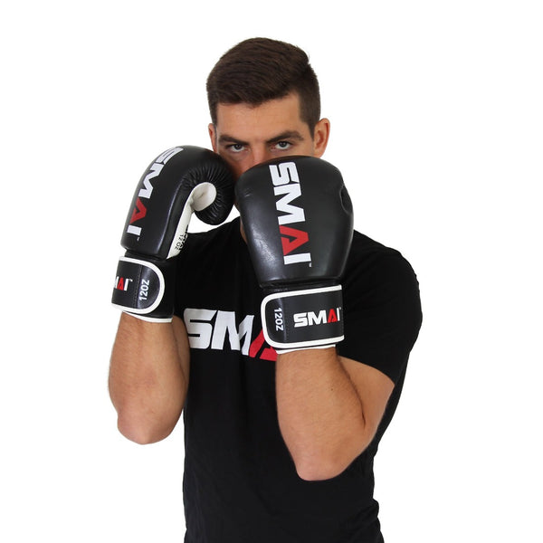 Man coving his face with Essentials Boxing Gloves