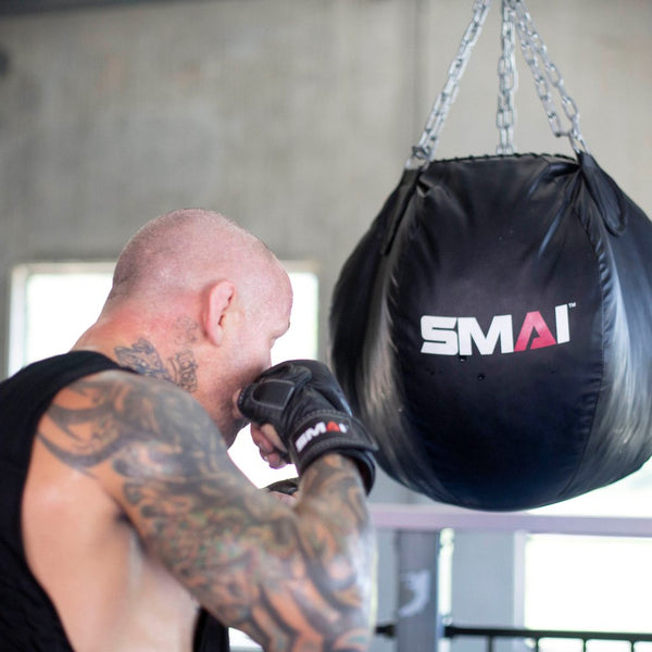 Man using Elite85 MMA Hybrid Sparring Gloves 7oz