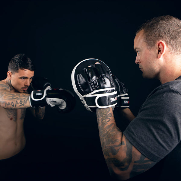 George Kambosos Punching the SMAI Essentials Boxing Mitt Side Angle