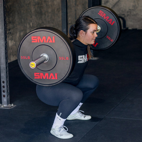 CrossFit Athlete Julia Hannaford Squatting with the 55LB SMAI Bumper Plate