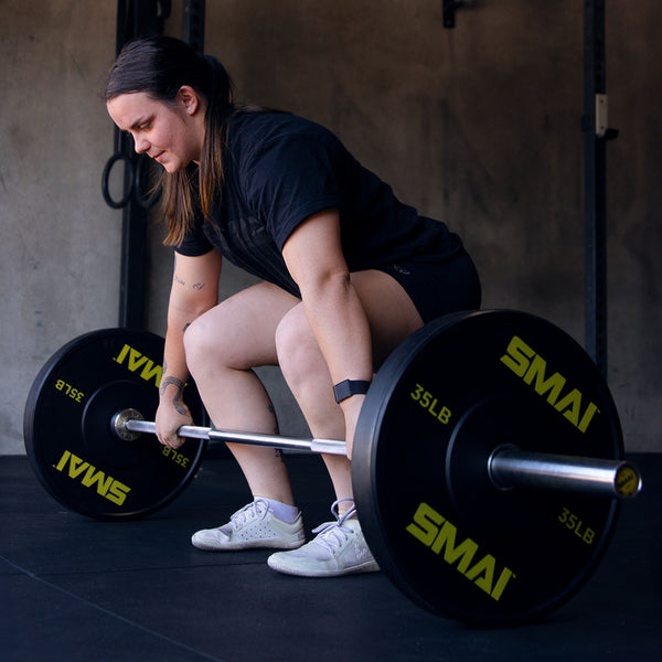 Julia Hannaford Australian CrossFit Athlete lifting 35lb HD Bumper Plates Yellow