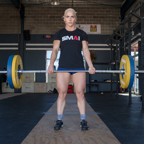 Woman using the IWF Olympic Barbell (Bearing) - 15kg